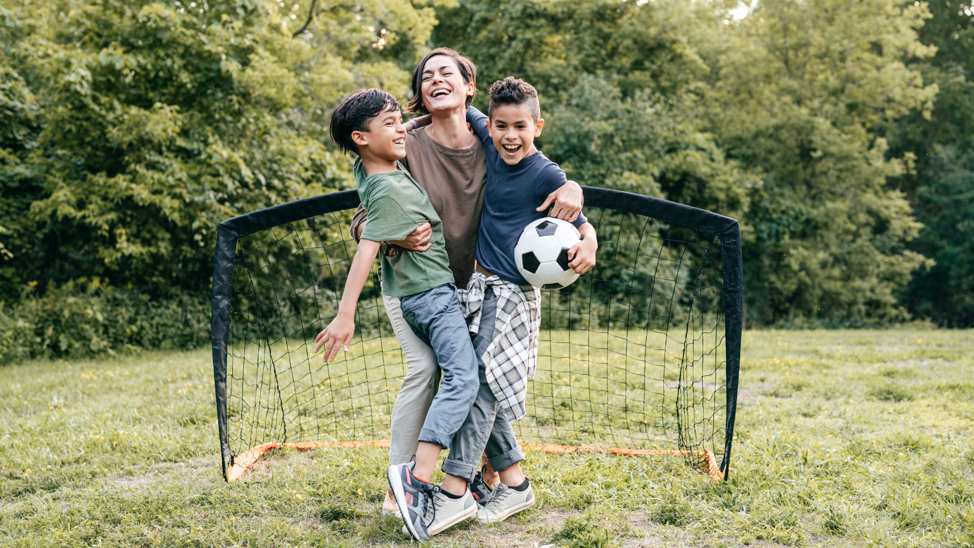 family playing soccer