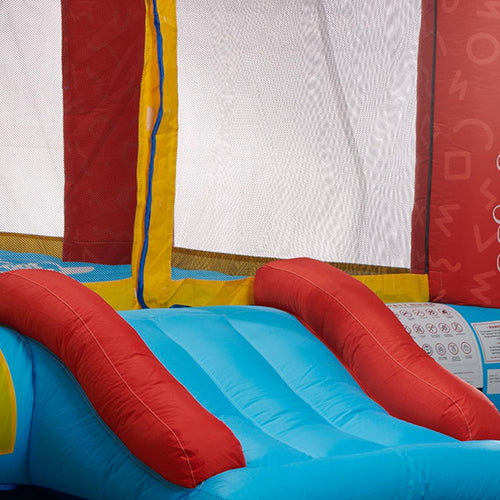 Colorful inflatable bounce house with red slide and blue platform.