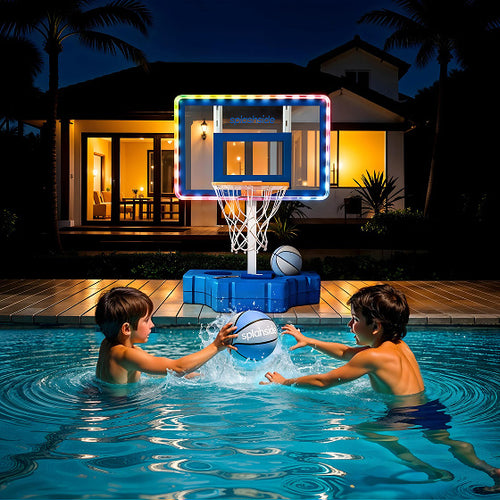 Two children playing with a basketball in a pool at night, illuminated by colorful lights.